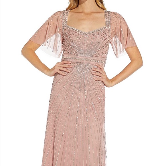 blush pink mob dress Cicinia Plus Size Mother Of The Bride Long Chiffon Beaded Sheath Floor Length V-neck and lays across a banded waist Blush Mother of the Bride